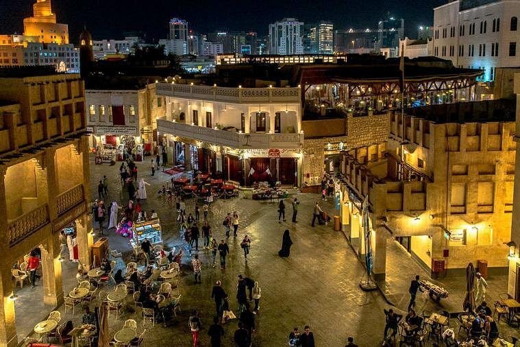 A lit alley of shops and cafes in Souq Waqif, Doha, after dark