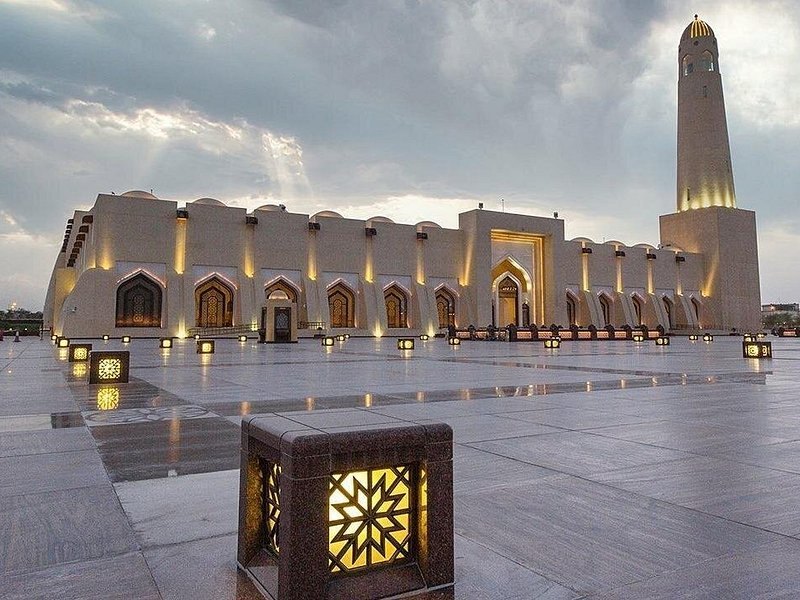 The State Grand Mosque in Doha lit at dusk, with its single minaret